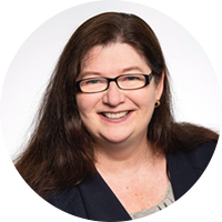 Business woman wearing a black suit and glasses