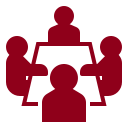 Garnet icon of 4 people sitting around a table 
