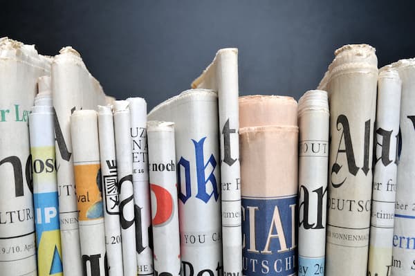 Side profile of a stack of newspaper articles