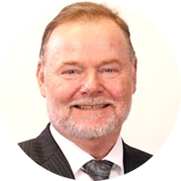 Older business man wearing black suit, white button-up and tie
